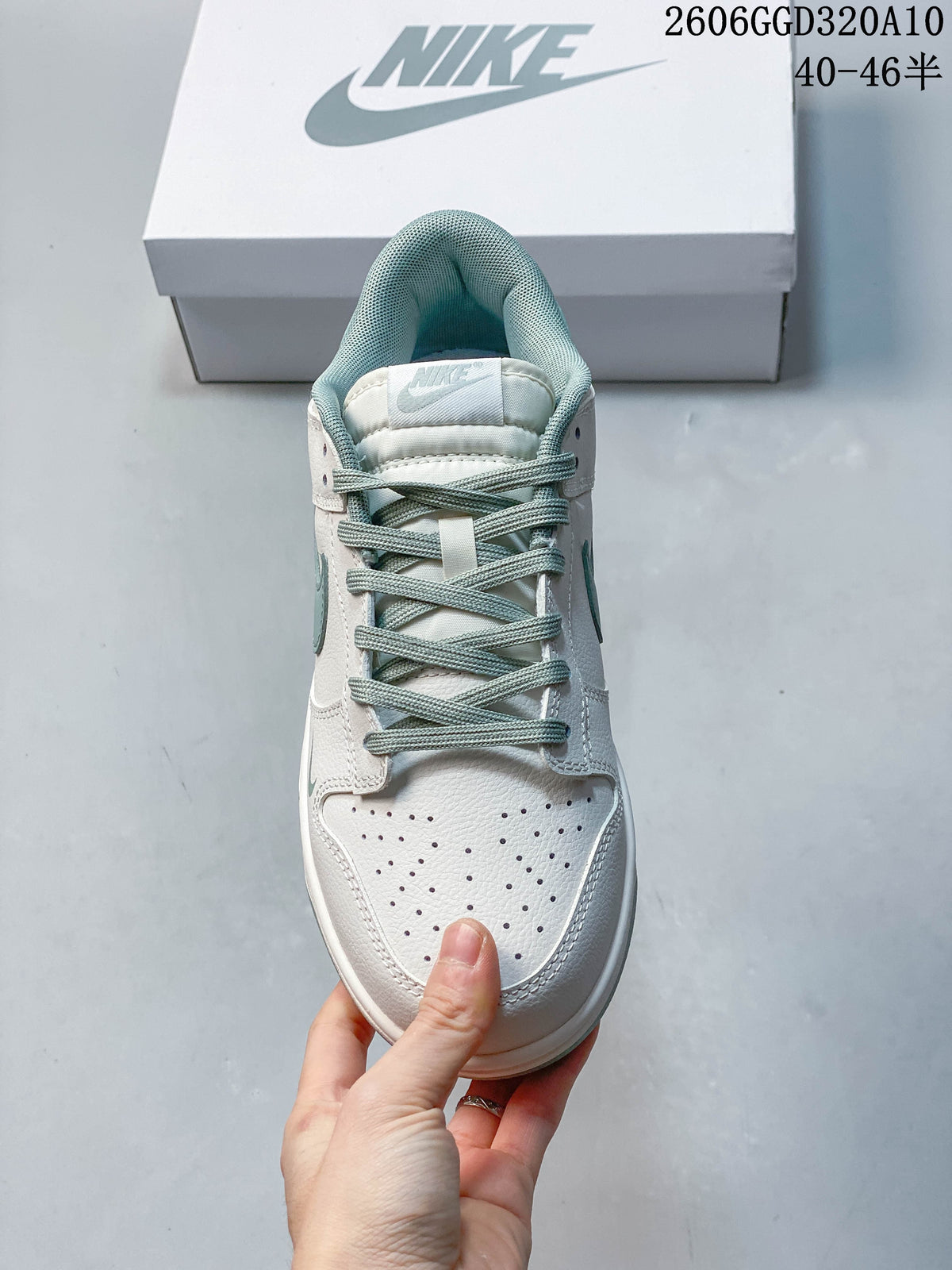 Top-down view of the perforated toe, laces, and padded collar of a Nike Dunk Low Retro sneaker.