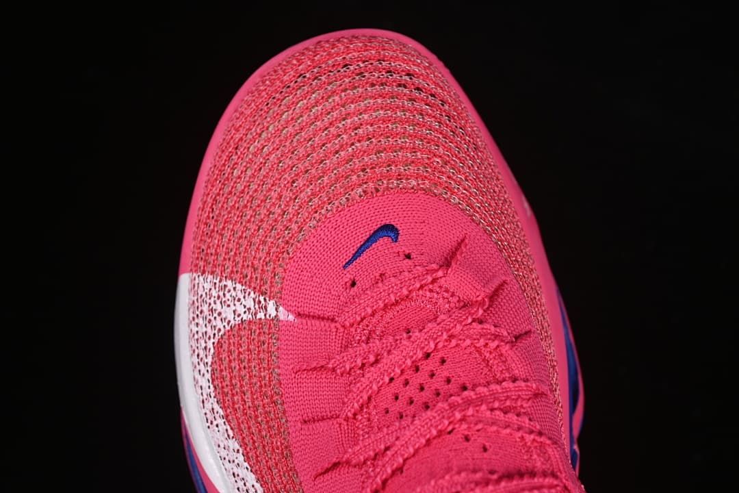 Top view of the pink knit toe box and lacing.