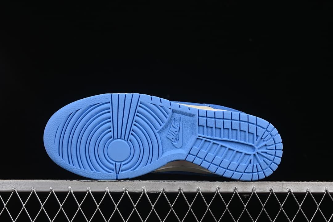 Underside view showing the blue rubber outsole tread