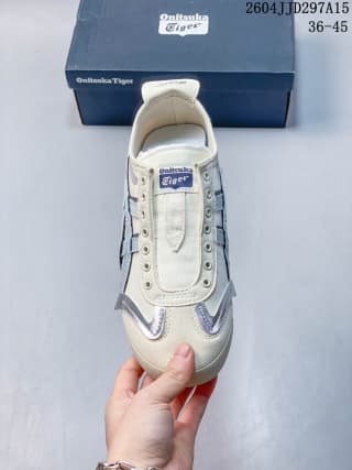 Top view showing the cream toe, blue side details, tongue branding, and lace area.