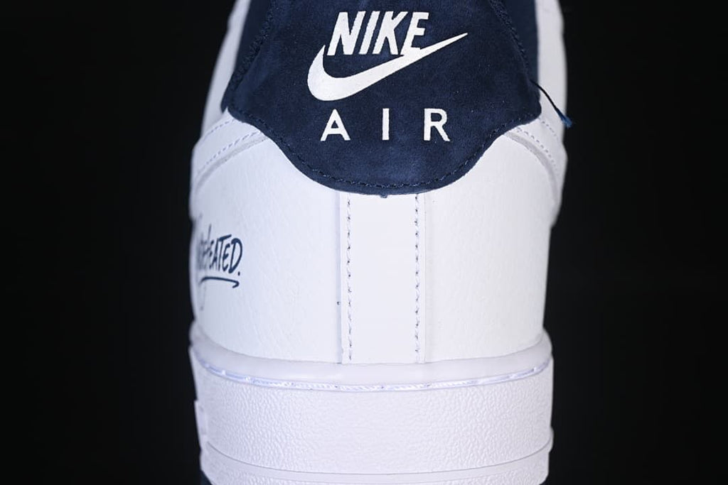 Rear view showing the navy heel tab and white heel panel