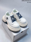 Pair of white SMFK sneakers with navy laces, side emblems, and chunky soles; image overlay shows code 2606JXD244A14 and sizes 35–40.