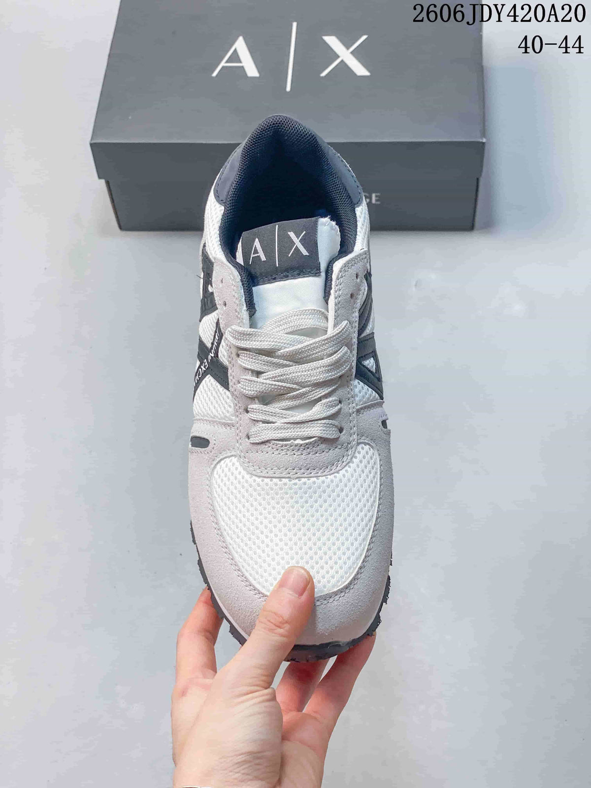 Front view showing the mesh-look toe, laces, and navy tongue label