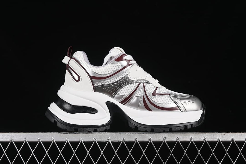 Side profile showing the chunky sole and burgundy accents