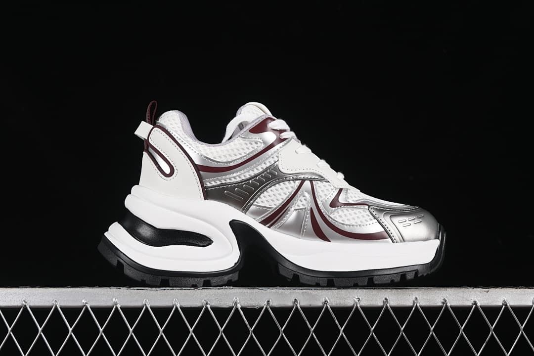 Side profile showing the chunky sole and burgundy accents