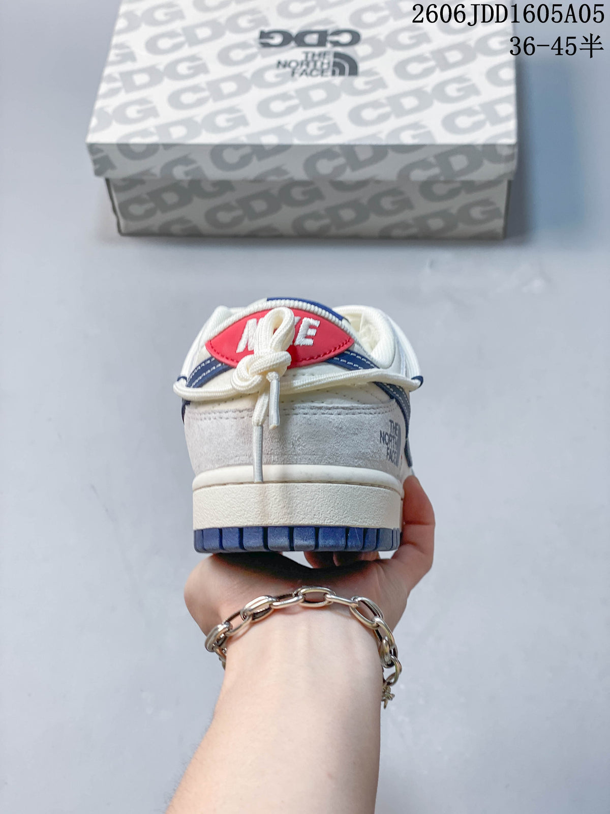Rear view of a Nike SB Dunk Low sneaker showing its heel details and navy outsole.
