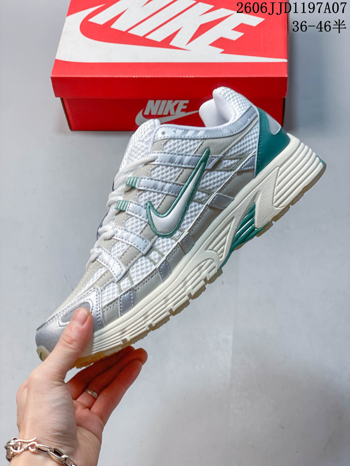 Side view highlighting the layered panels, mesh-look upper, and teal details