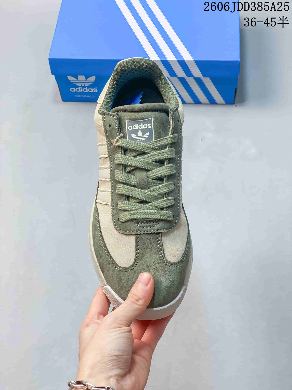 Front view of the adidas SL 72 sneaker with green laces