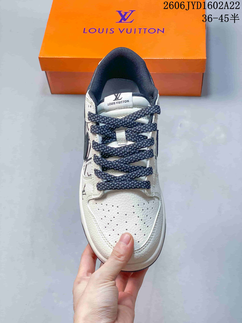 Top view of the sneaker showing its perforated toe and navy laces