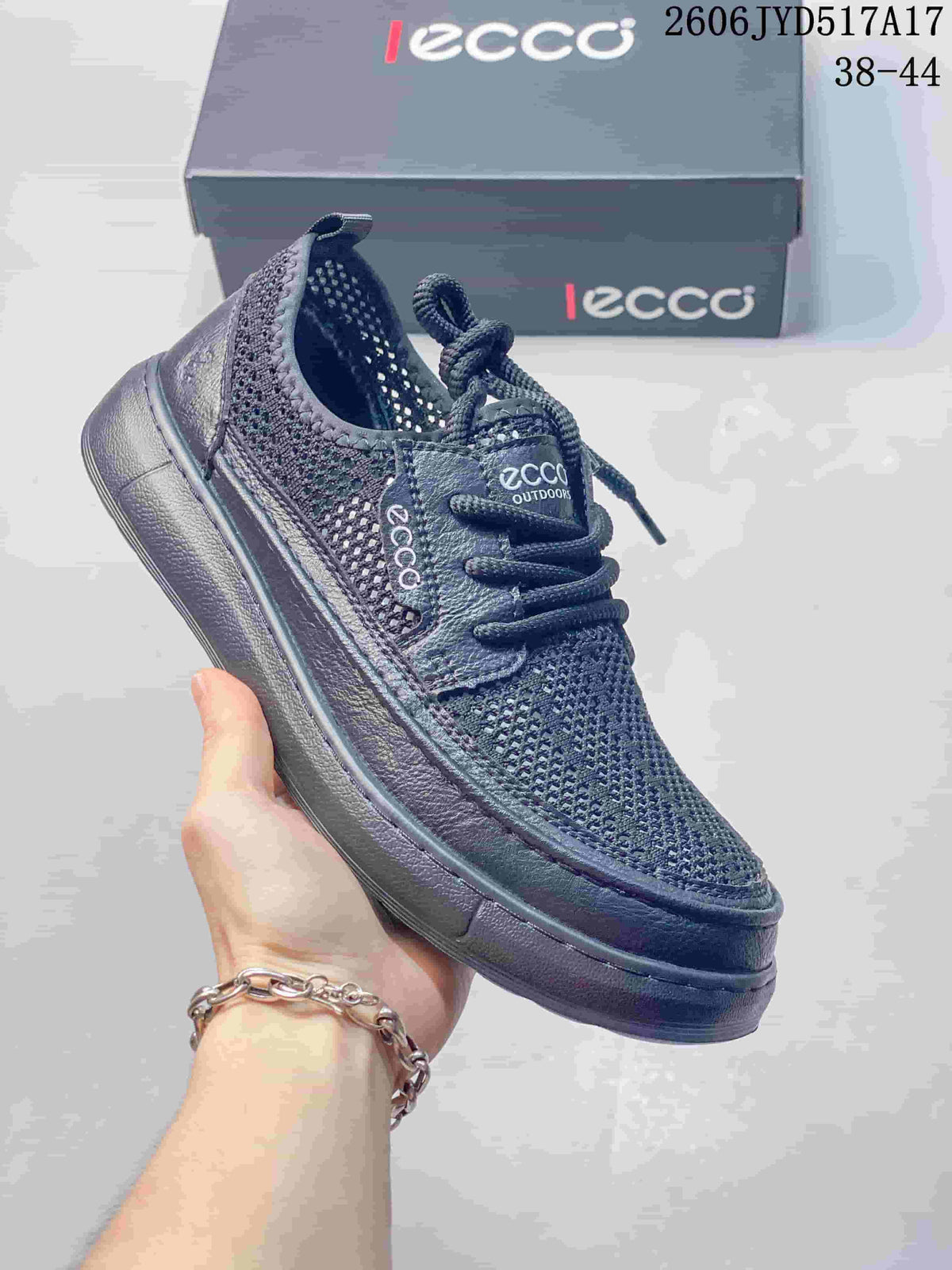 Side view of a dark navy ECCO-branded lace-up shoe with mesh-like panels.