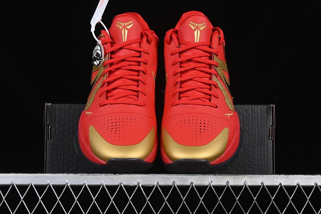 Front view of the shoes showing perforated toes and gold accents