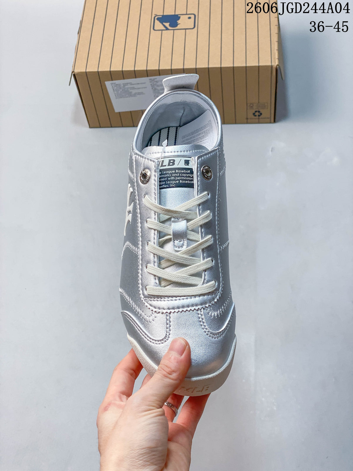 Front view of the silver lace-up sneaker with cream laces