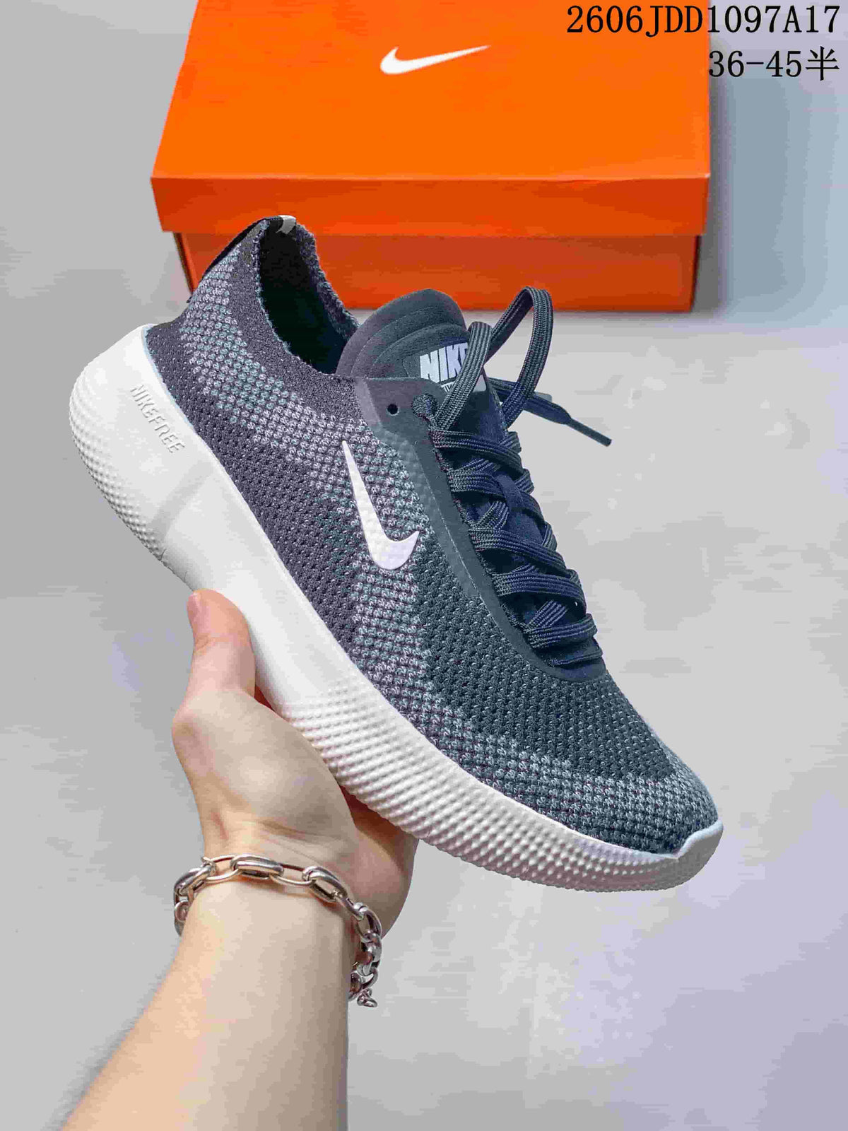 Charcoal Nike Free 2025 low-top shoe with a white Swoosh and sole.