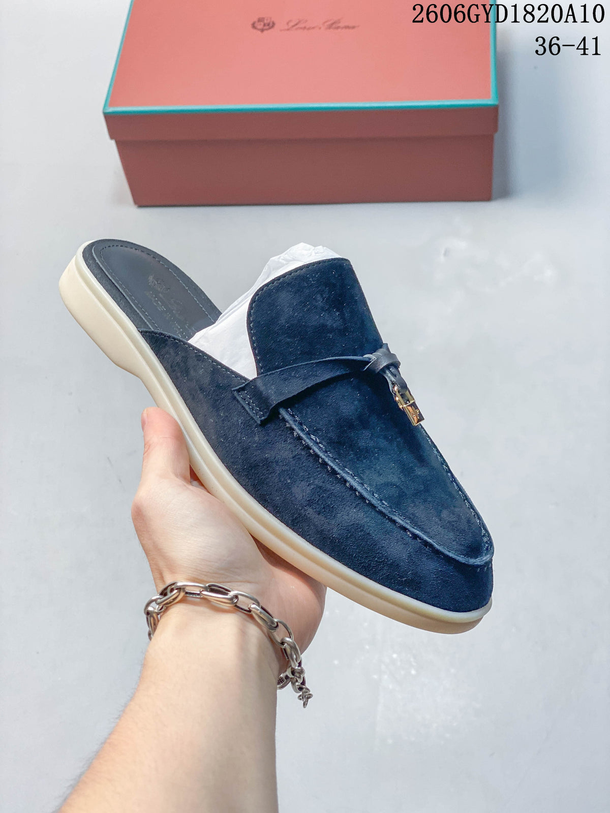 Angled view of a navy lock-detail mule loafer; photo overlay shows style code 2606GYD1820A10 and sizes 36–41.