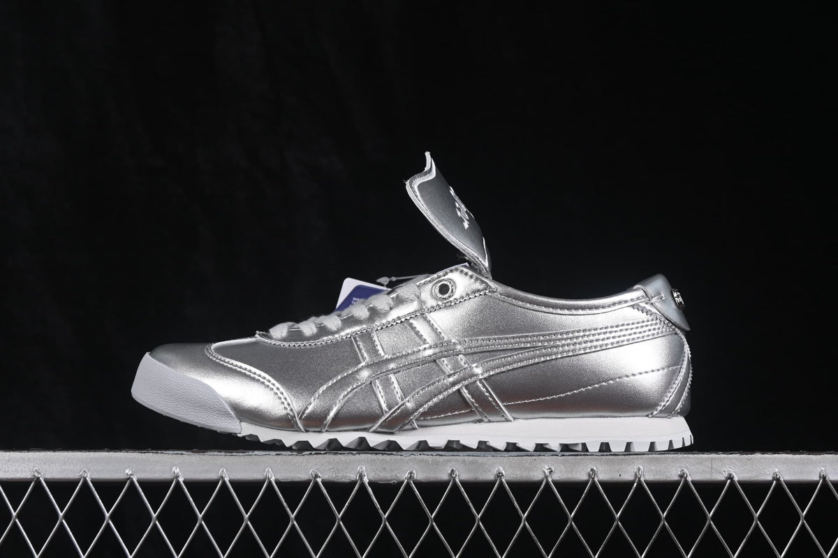 Side profile of the silver Onitsuka Tiger Mexico 66 Golf sneaker showing the tonal side stripes and low-top construction.