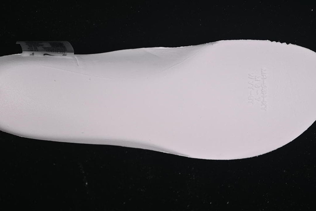 Close-up of the underside of a white shoe insert