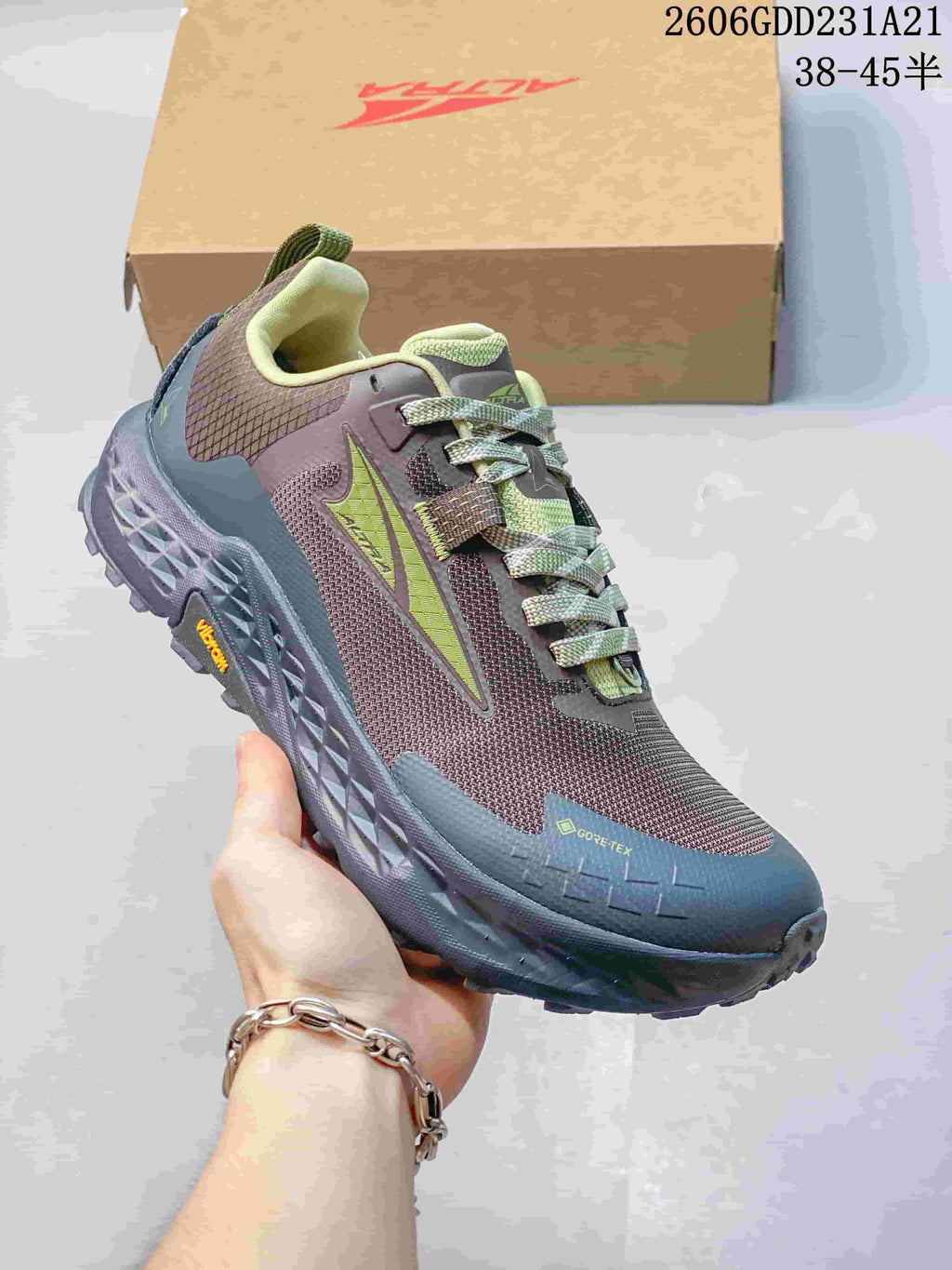 Angled side view showing the shoe's color blocking, laces, and Gore-Tex marking