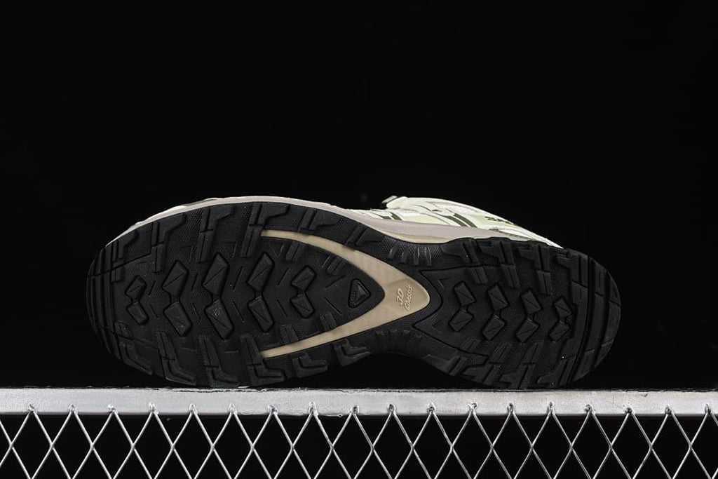 Underside showing the black lugged outsole.