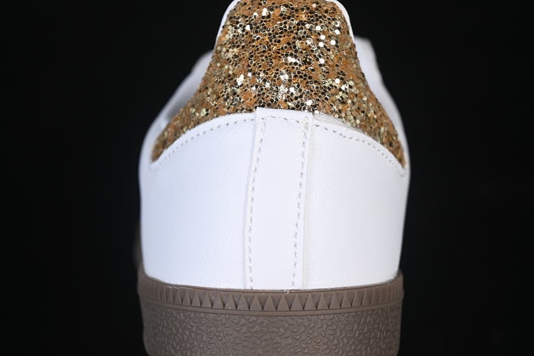 Rear close-up of the white heel and gold glitter-style heel panel