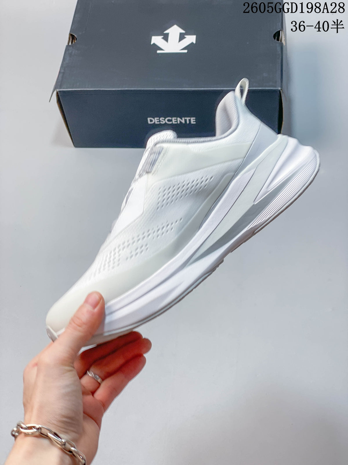 Side profile of the white sneaker with a thick sole