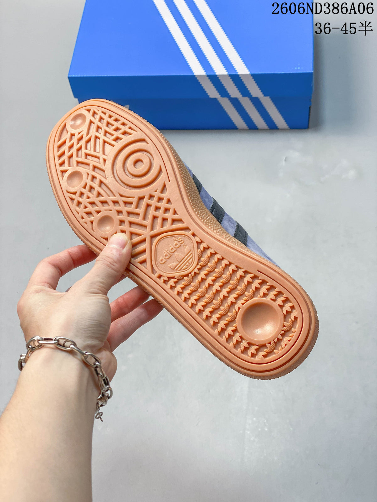 Underside of the sneaker showing a patterned gum-colored outsole