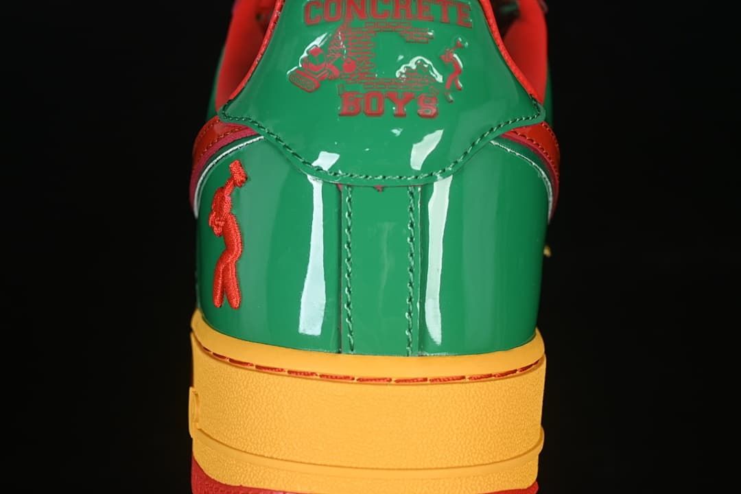 Rear view showing green heel panels and decorative graphics