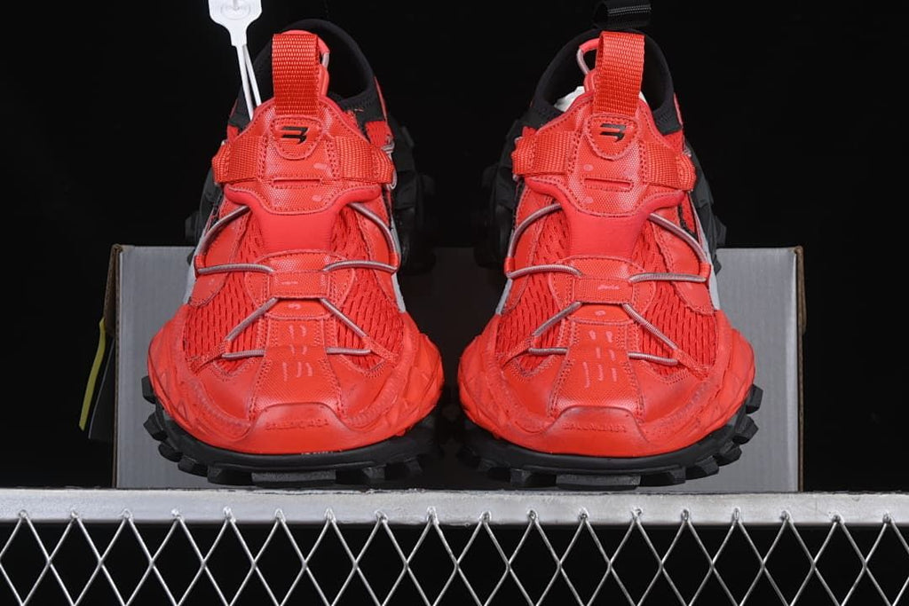 Front view of the pair showing the red uppers and rugged black outsole
