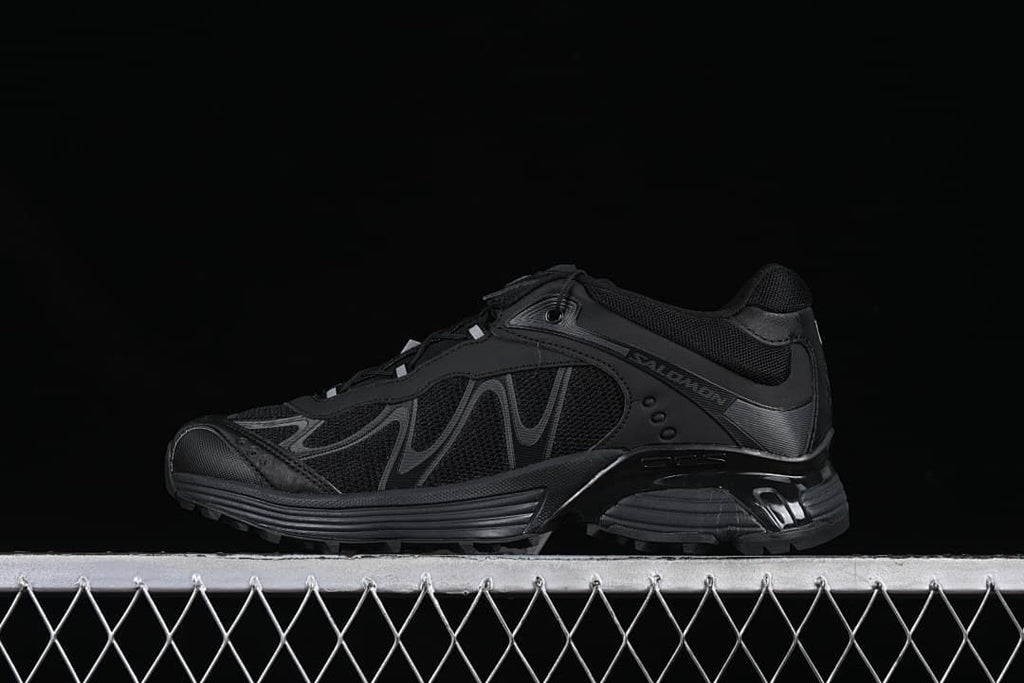 Black Salomon XT-Whisper shoe shown in side profile