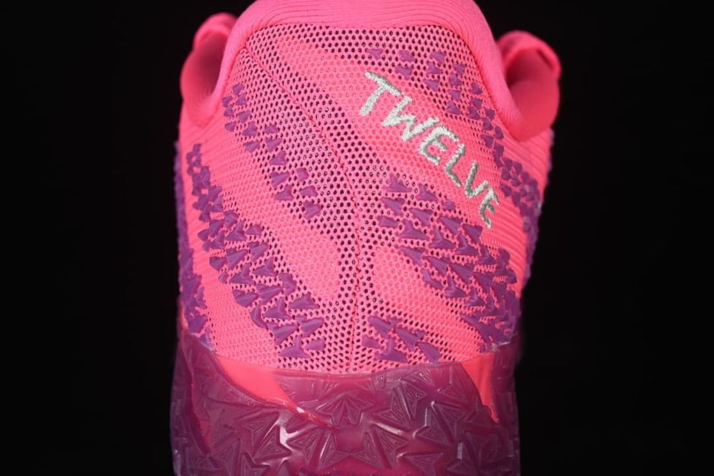 Rear view showing patterned pink and purple upper and heel details
