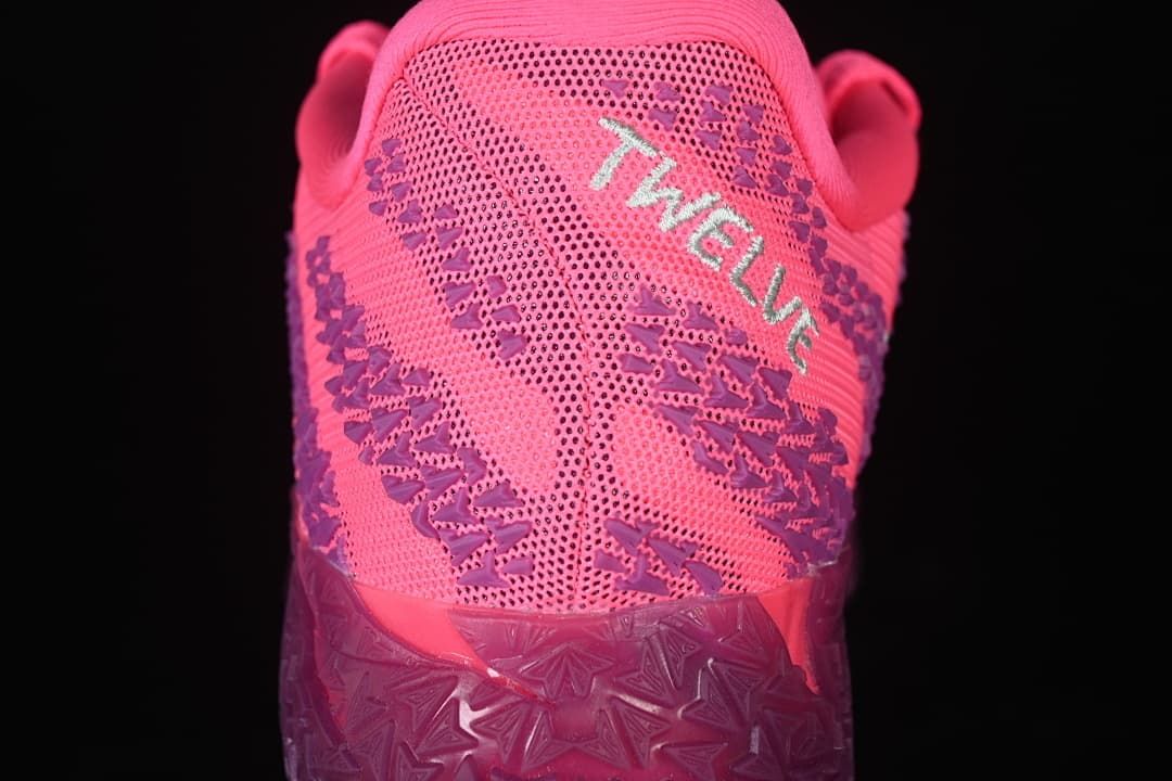 Rear view showing patterned pink and purple upper and heel details