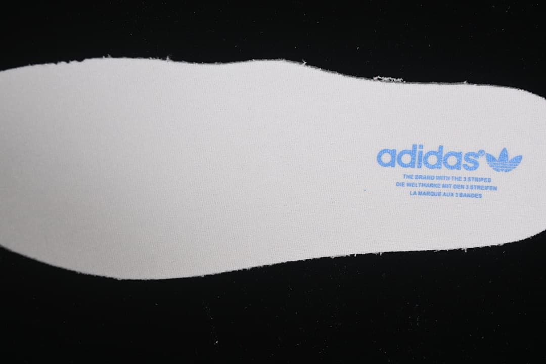 Reverse side of the insole with adidas branding.