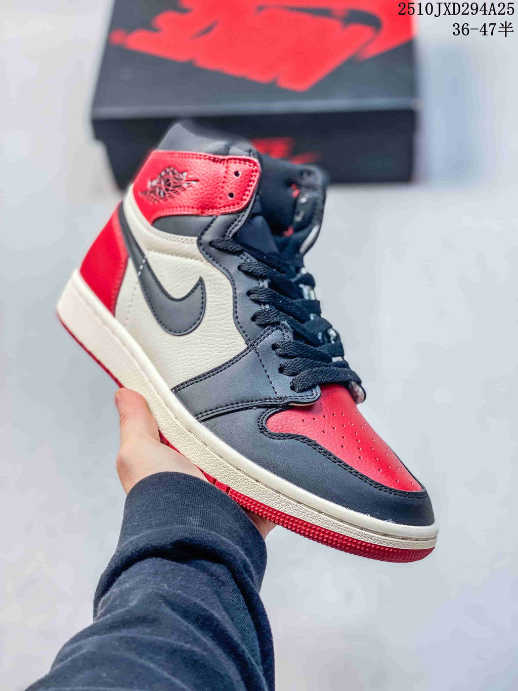 Red, white, and dark gray high-top sneaker with lace-up closure