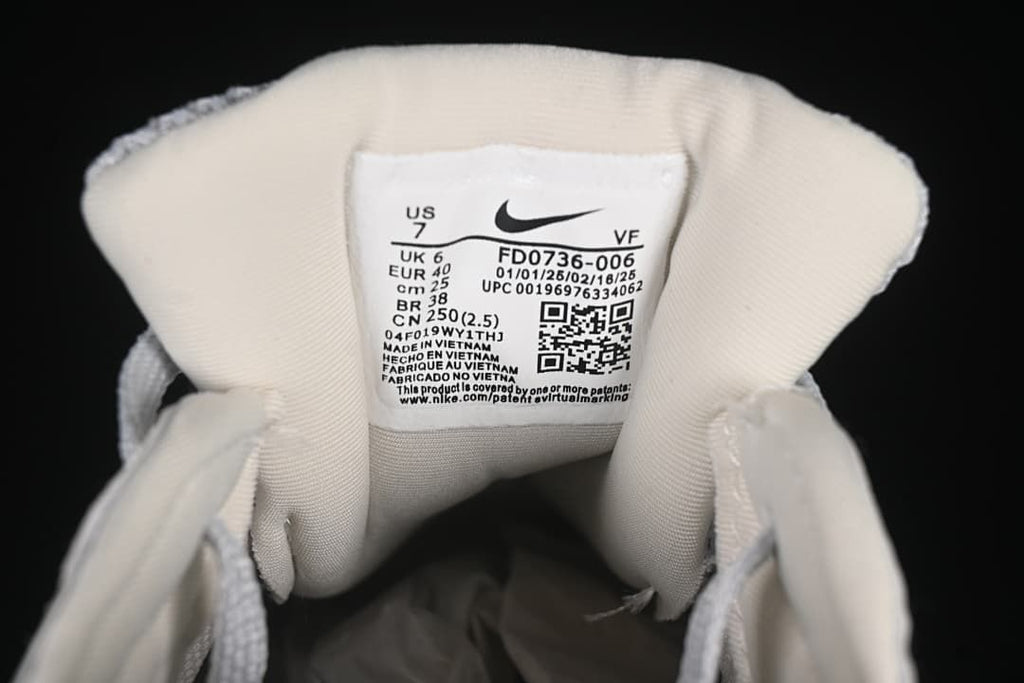 Close-up of the shoe tongue label showing FD0736-006 and sample size details