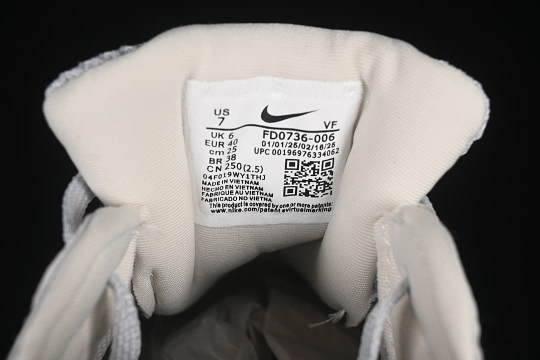 Close-up of the shoe tongue label showing FD0736-006 and sample size details