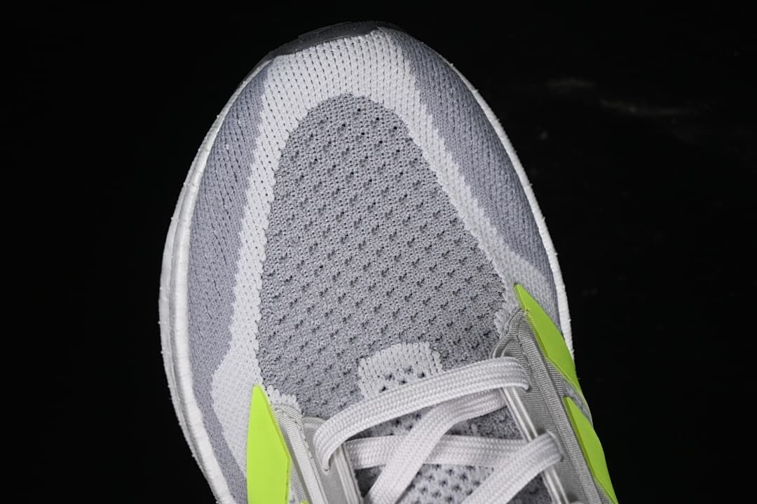 Top view of the gray knit-patterned toe and laces.