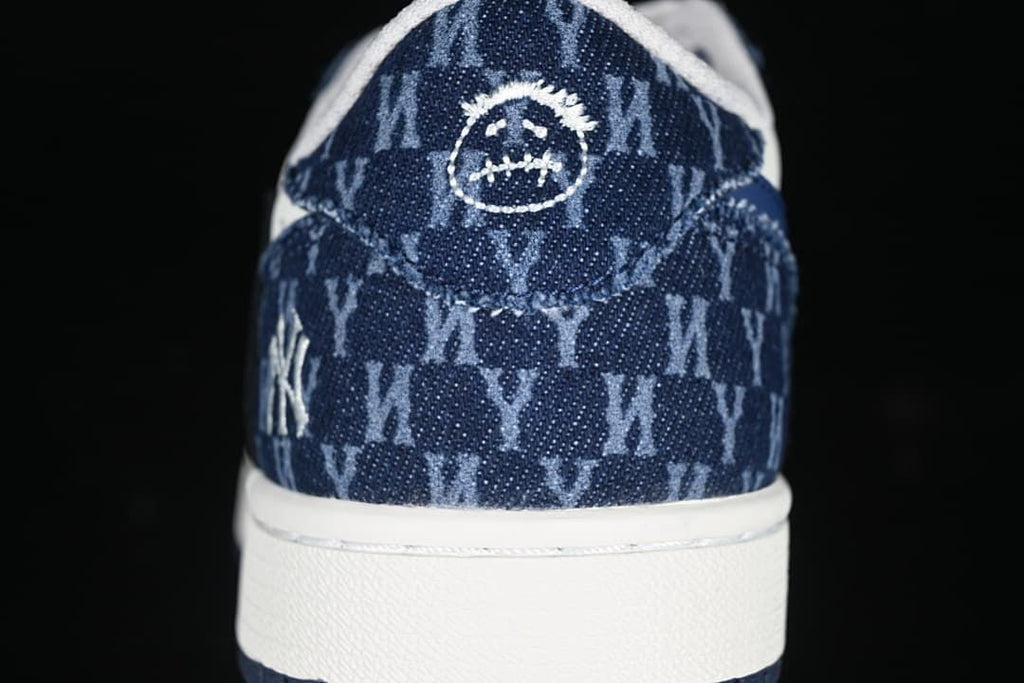 Heel close-up with patterned navy panels and embroidered details