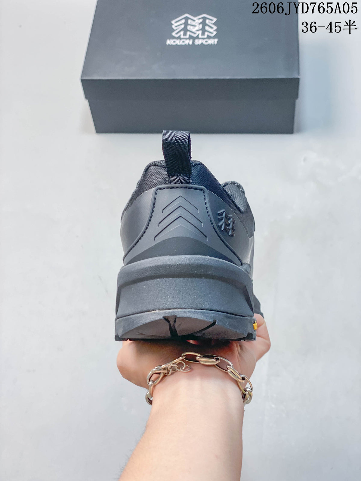 Rear view of the dark gray hiking shoe showing the heel and outsole