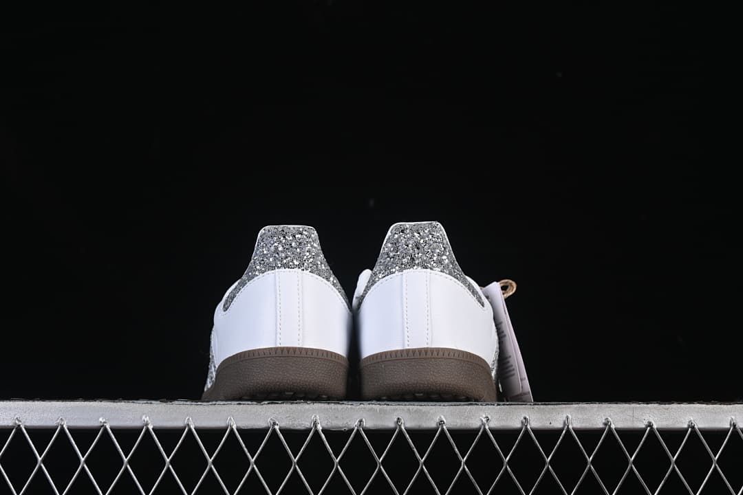 Rear view of both sneakers showing the glitter-effect heel panels.