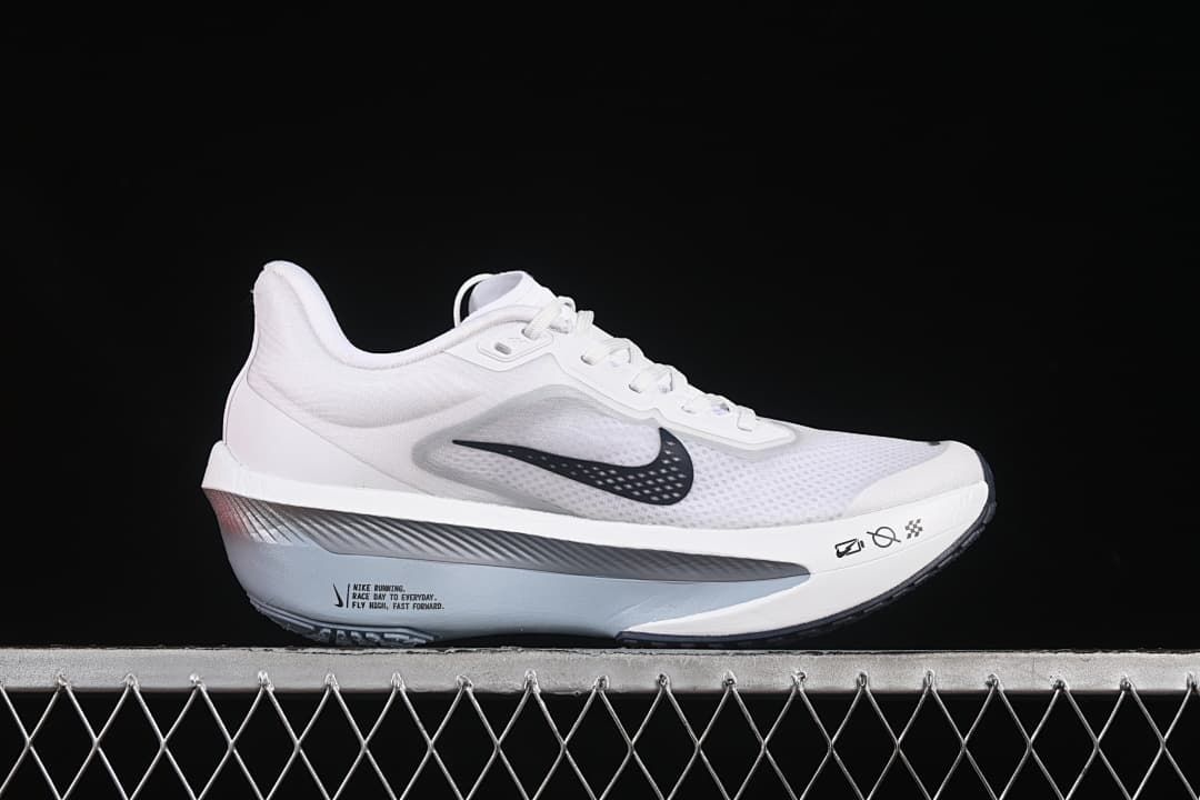 Side profile of a white Nike Zoom Fly 6 running shoe with dark Swoosh accents.