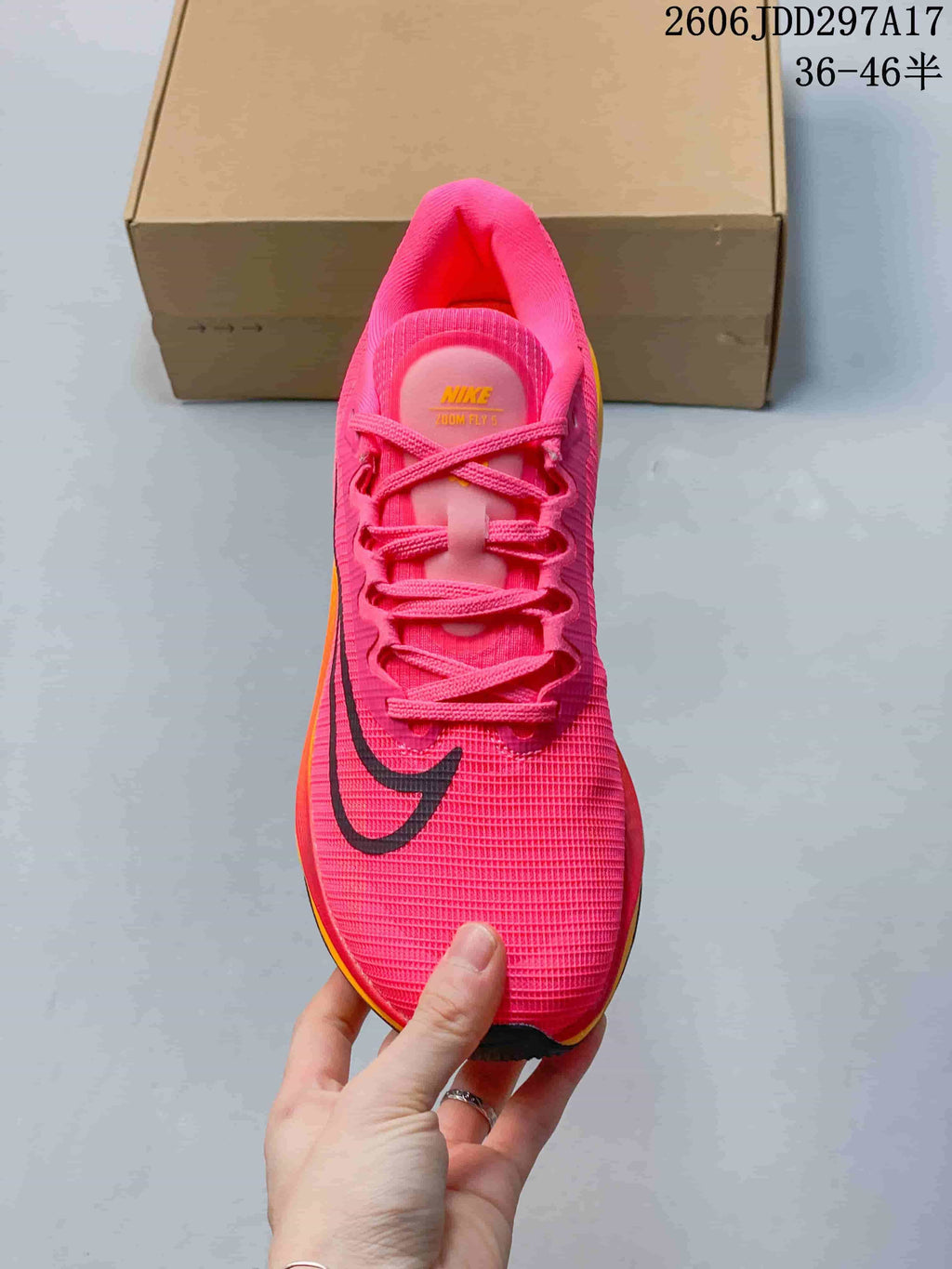 Top view of a pink Nike Zoom Fly 5 showing laces and tongue label