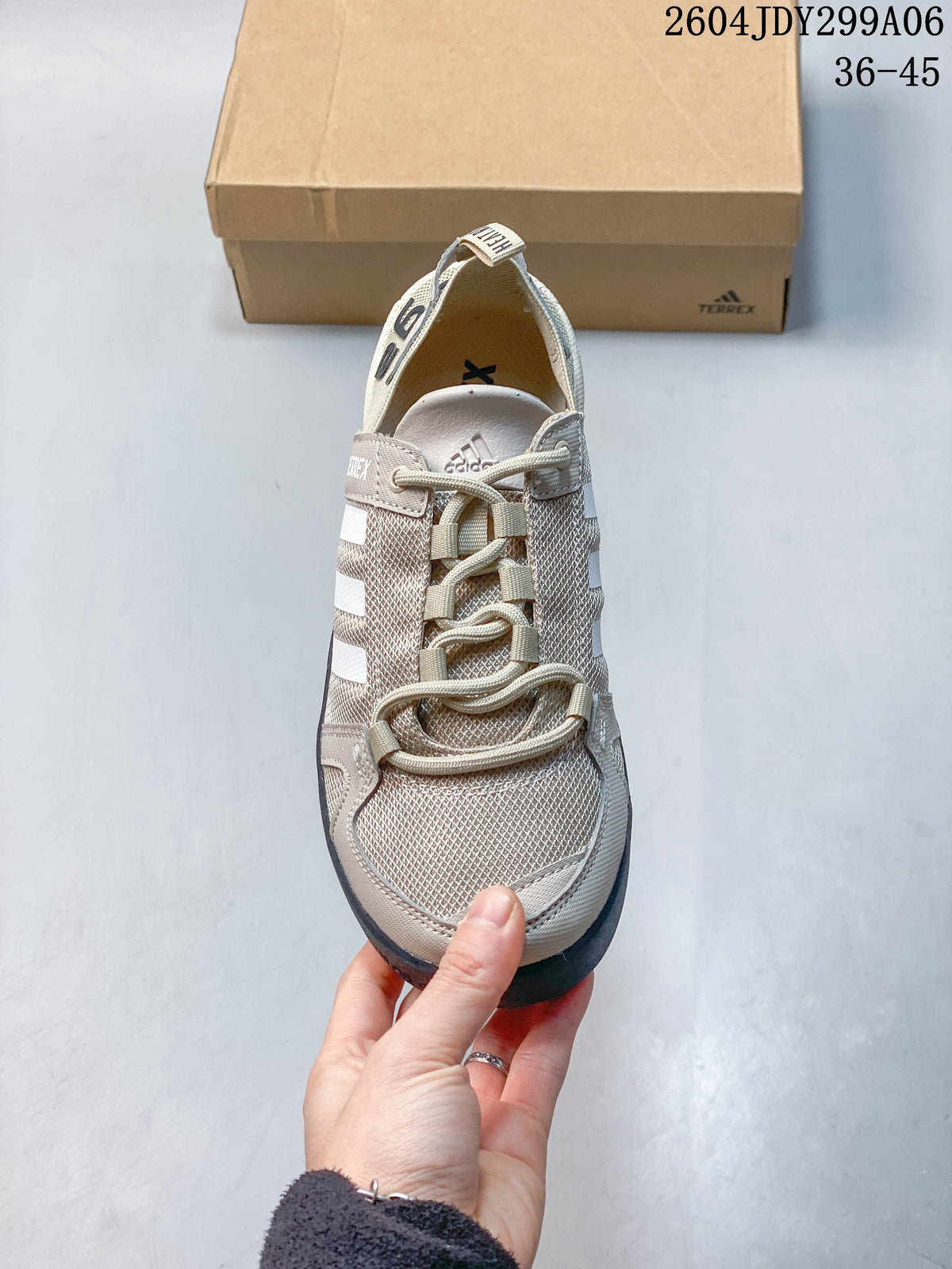 Front view of a light beige Adidas Terrex lace-up shoe with a textured upper; image overlay reads 36–45.
