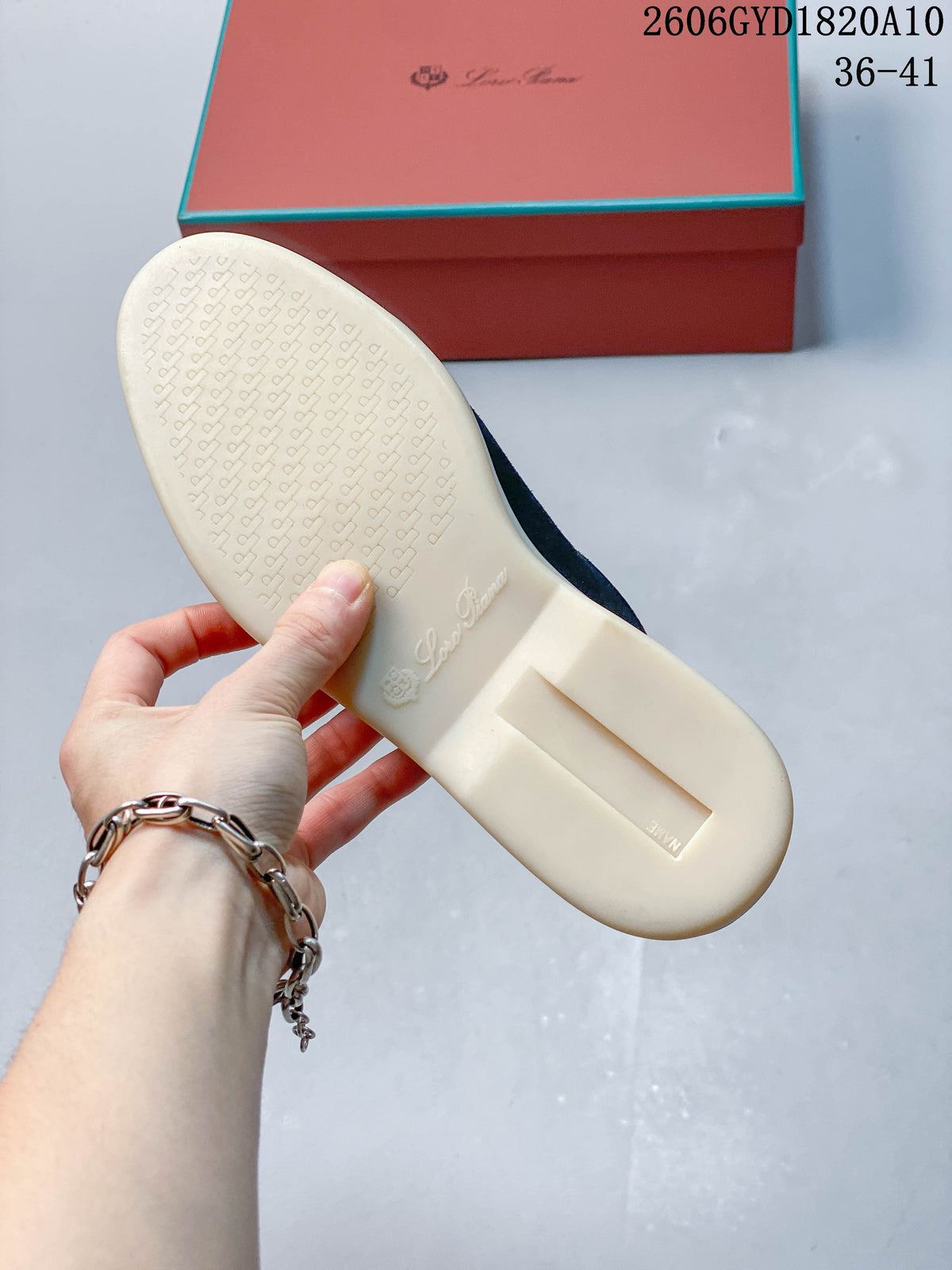 Underside of a navy mule loafer showing a light-colored sole; photo overlay shows style code 2606GYD1820A10 and sizes 36–41.