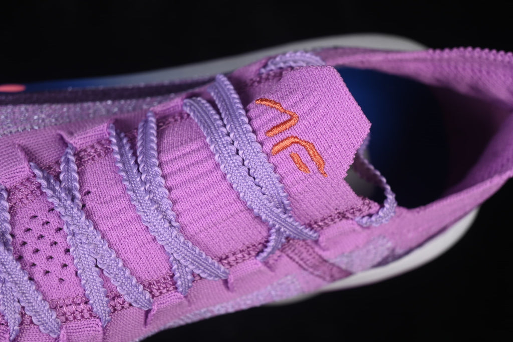 Close-up of the lavender laces and purple tongue.