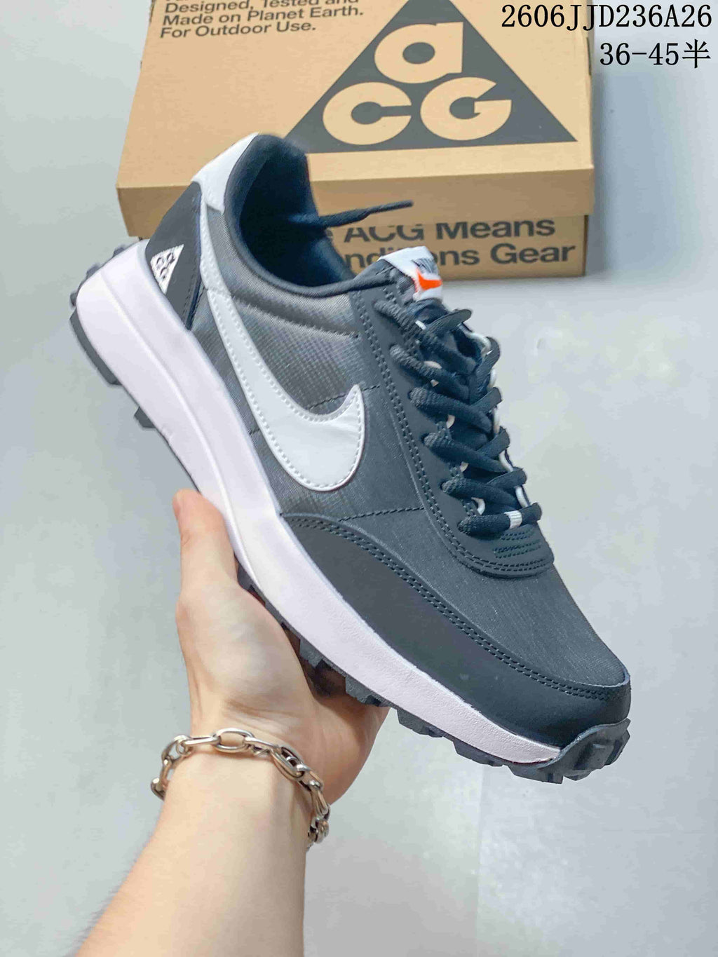 Charcoal and white Nike ACG LDV sneaker shown from the side with a lugged outsole.