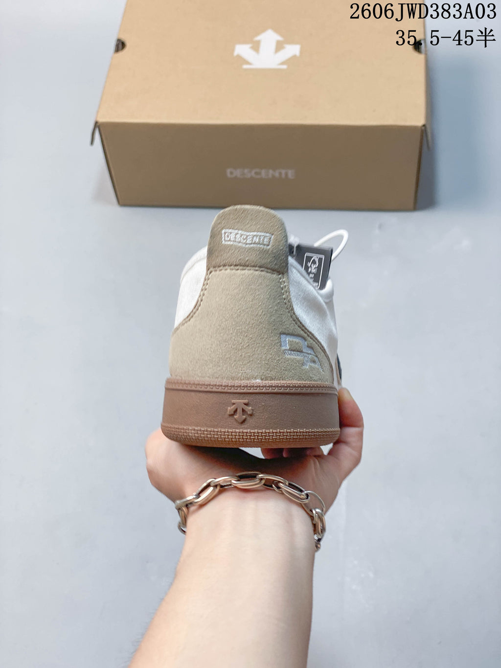 Rear view showing beige heel panels and gum-colored sole