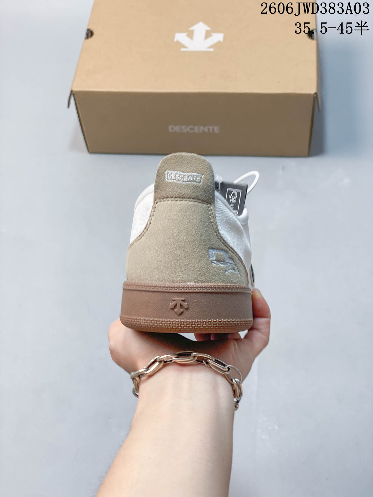 Rear view showing beige heel panels and gum-colored sole