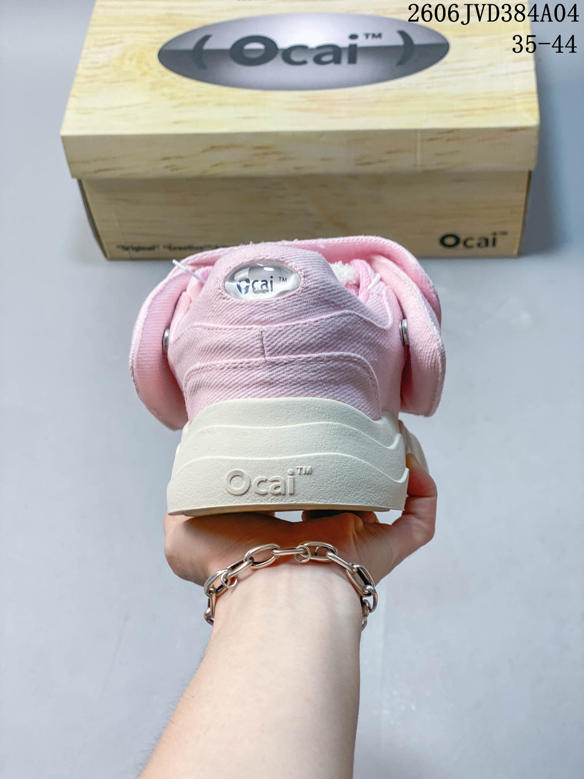 Rear view of the pink sneakers showing the padded heel and chunky sole.