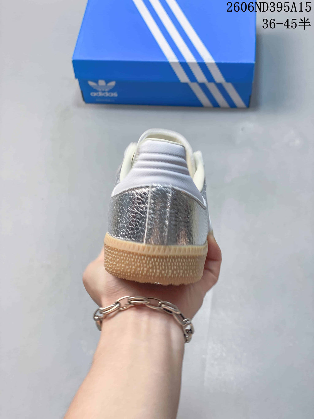 Rear view showing the silver heel panel and gum-colored outsole