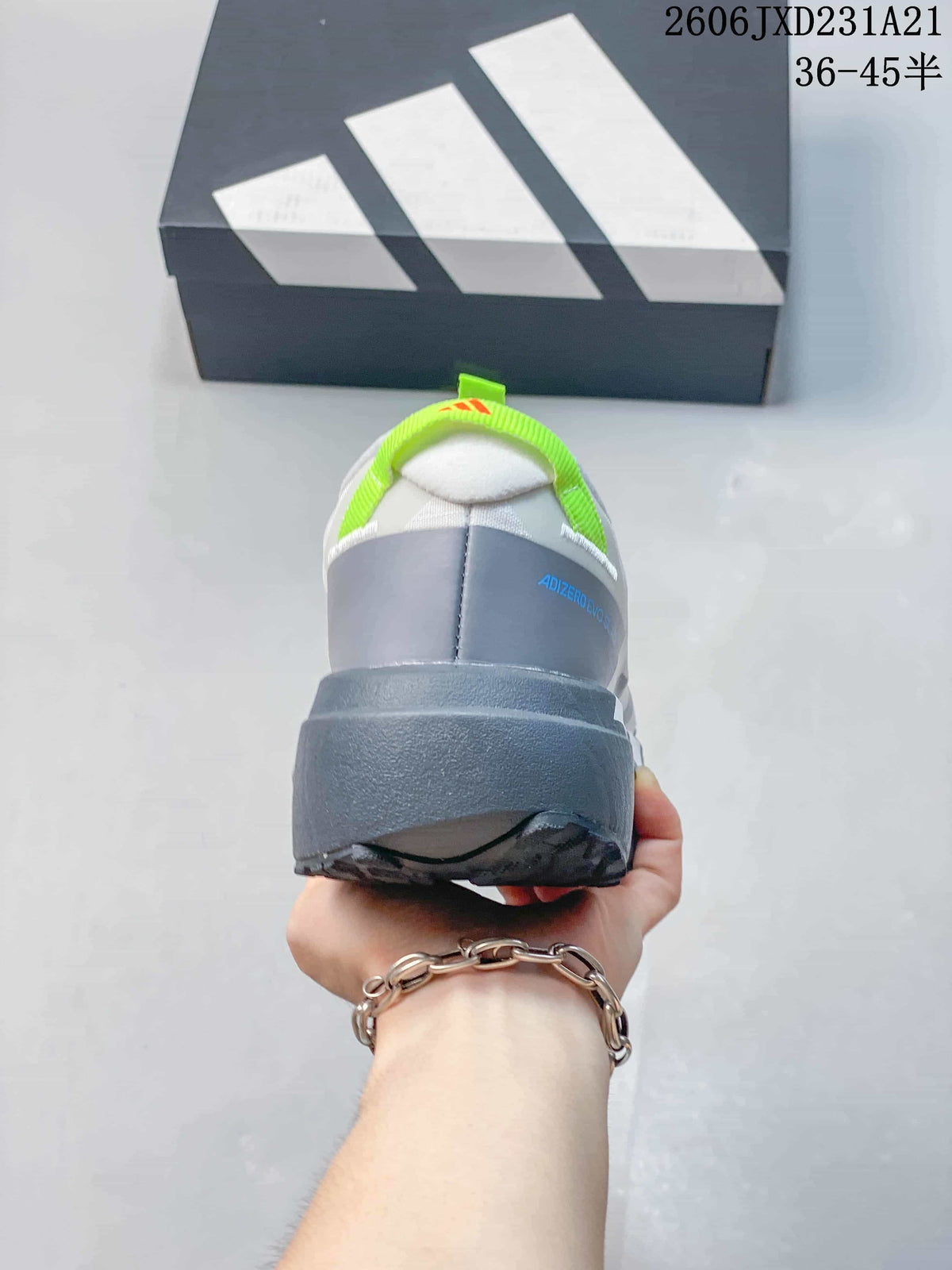Rear view of a running shoe showing its grey heel and lime pull tab.
