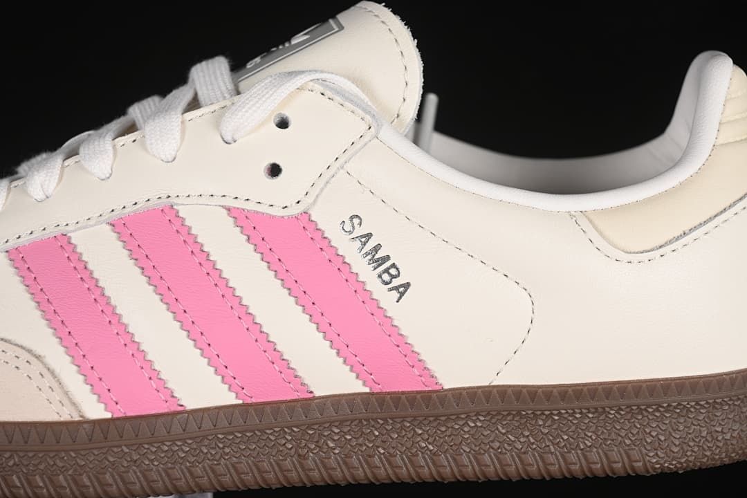 Close-up of pink side stripes, Samba lettering, and gum outsole